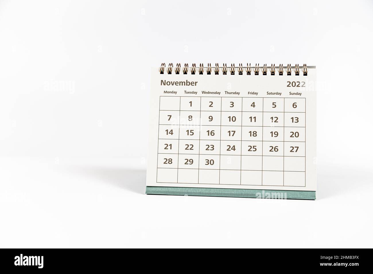 November 2022 paper calendar month page on white background Stock Photo