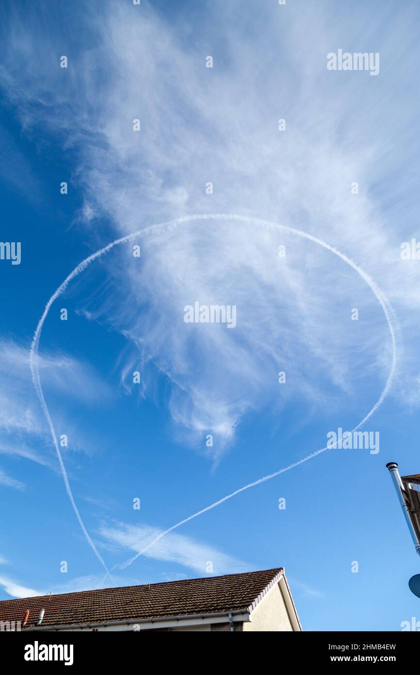A aeroplanes vapour trail in a full circle Stock Photo