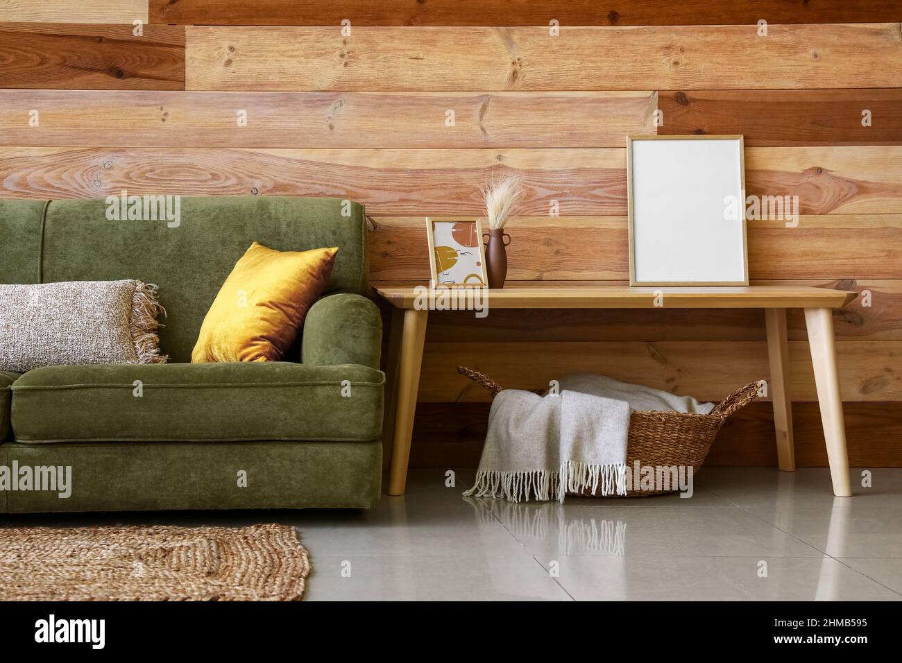 Interior of modern living room with green sofa and coffee table Stock ...