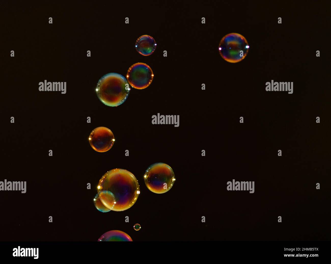 Beautiful soap bubbles on dark background Stock Photo - Alamy