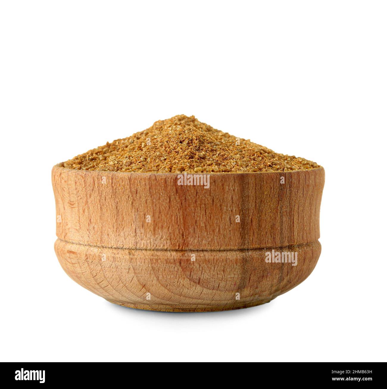 Wooden bowl of coriander powder on white background Stock Photo - Alamy