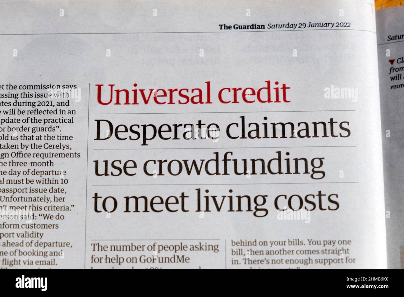 'Universal credit Desperate claimants use crowdfunding to meet living costs' Guardian newspaper headline covid loan clipping 29 January 2022 London UK Stock Photo