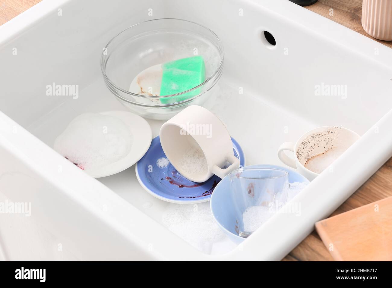 Dirty dishes in ceramic sink, closeup Stock Photo Alamy