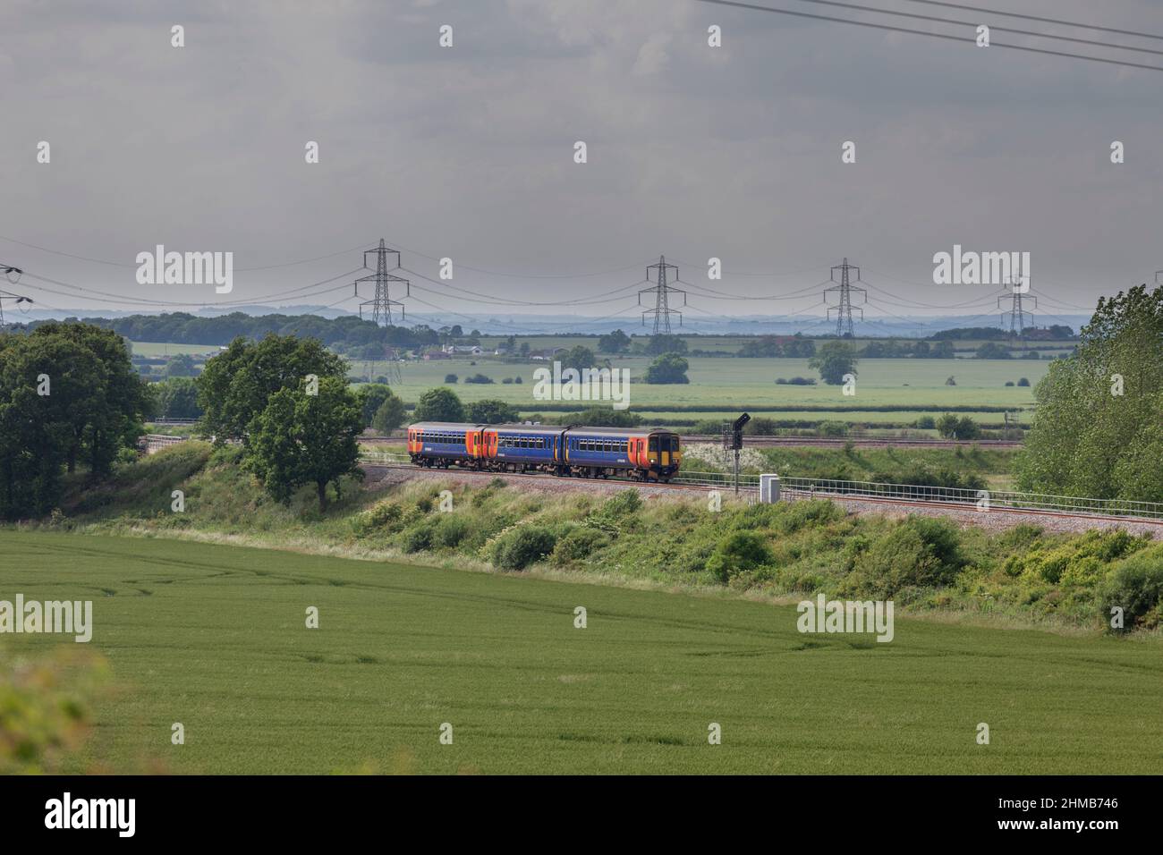 Allington (west of Grantham) East Midlands trains class 156 156411 + class 153 153383 working train 2S23 the 1545 Nottingham - Skegness Stock Photo