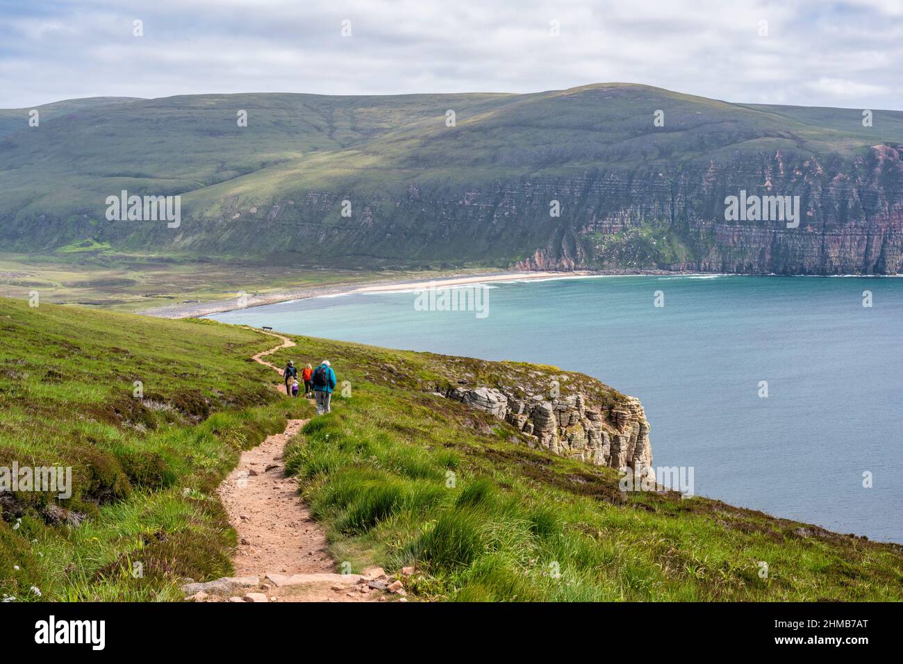 Walkers on the footpath from the Old Man of Hoy to Rackwick Bay, Isle of Hoy, Orkney, Scotland, UK Stock Photo