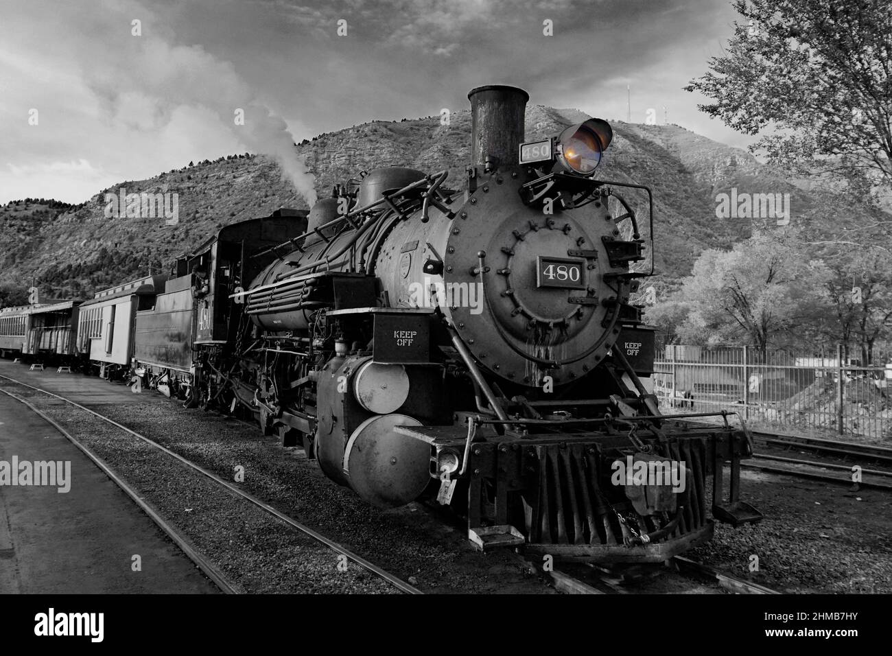 Old steam engine with selective color on its headlight. Durango and Silverton narrow gauge train in Colorado. Stock Photo
