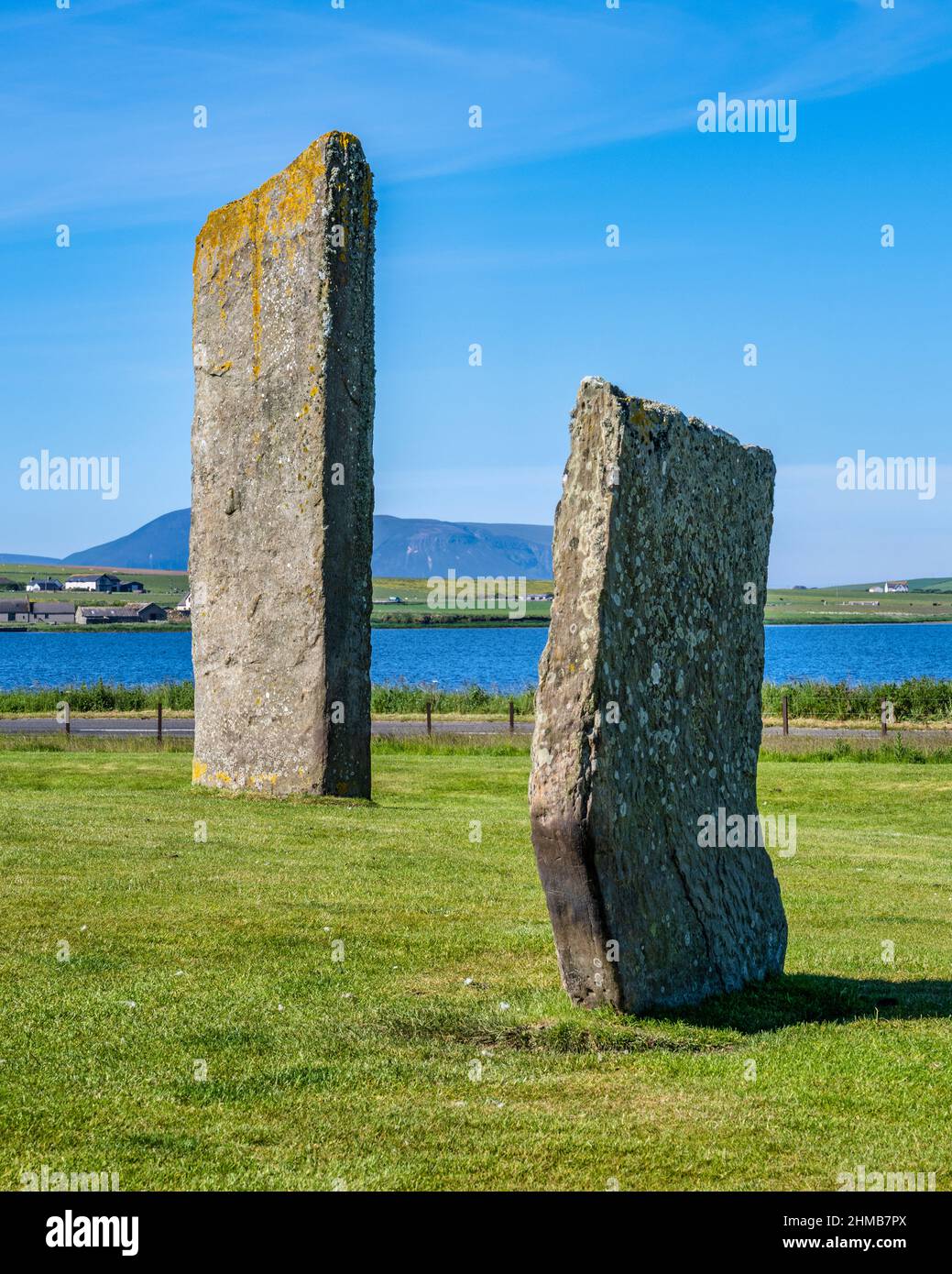 View of the Stones of Stenness looking west, with Loch of Stenness in the background and the hills of Hoy in the distance, Orkney, Scotland, UK Stock Photo