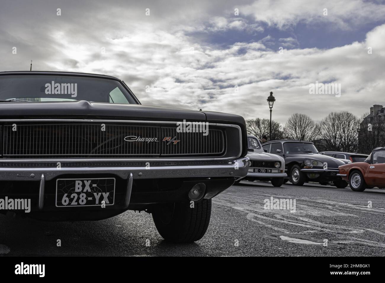 Old black Dodge Charger parked in the center of the city Stock Photo