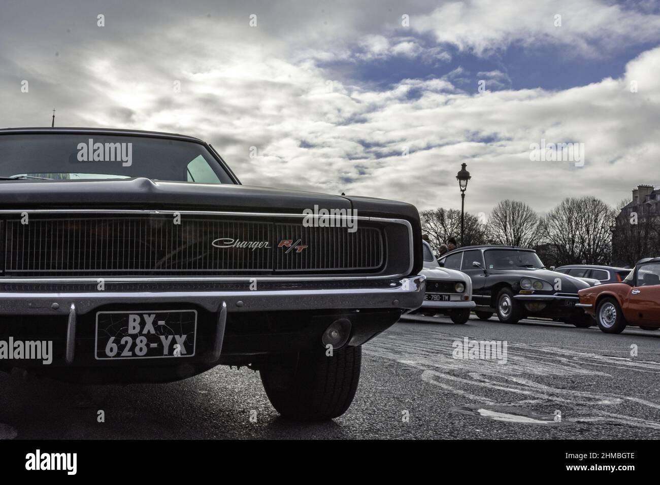 Old black Dodge Charger parked in the center of the city Stock Photo
