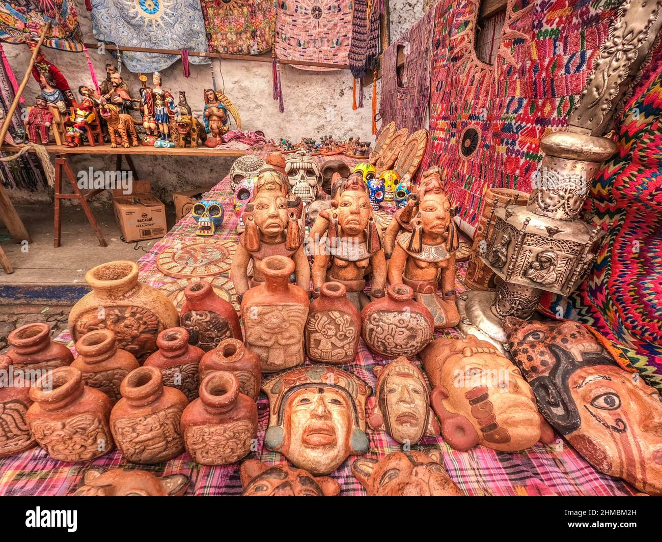 Masks  ceramic pottery for sale at the Sunday Market in Chichicastenango, Guatemala Stock Photo