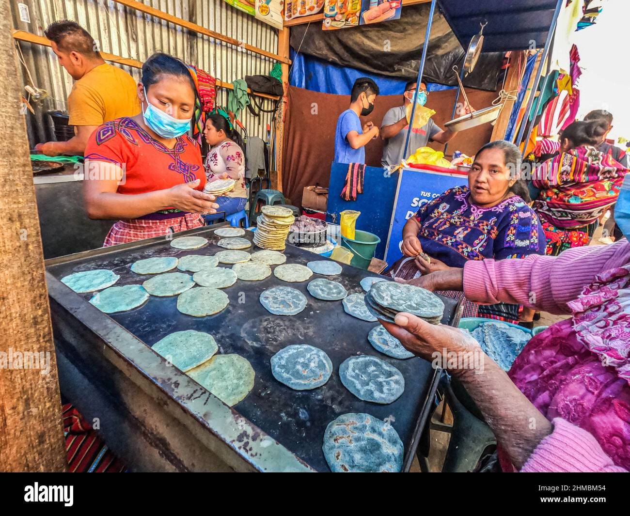 Guatemalan ladies making tortillas in Antigua, Guatemala Stock Photo