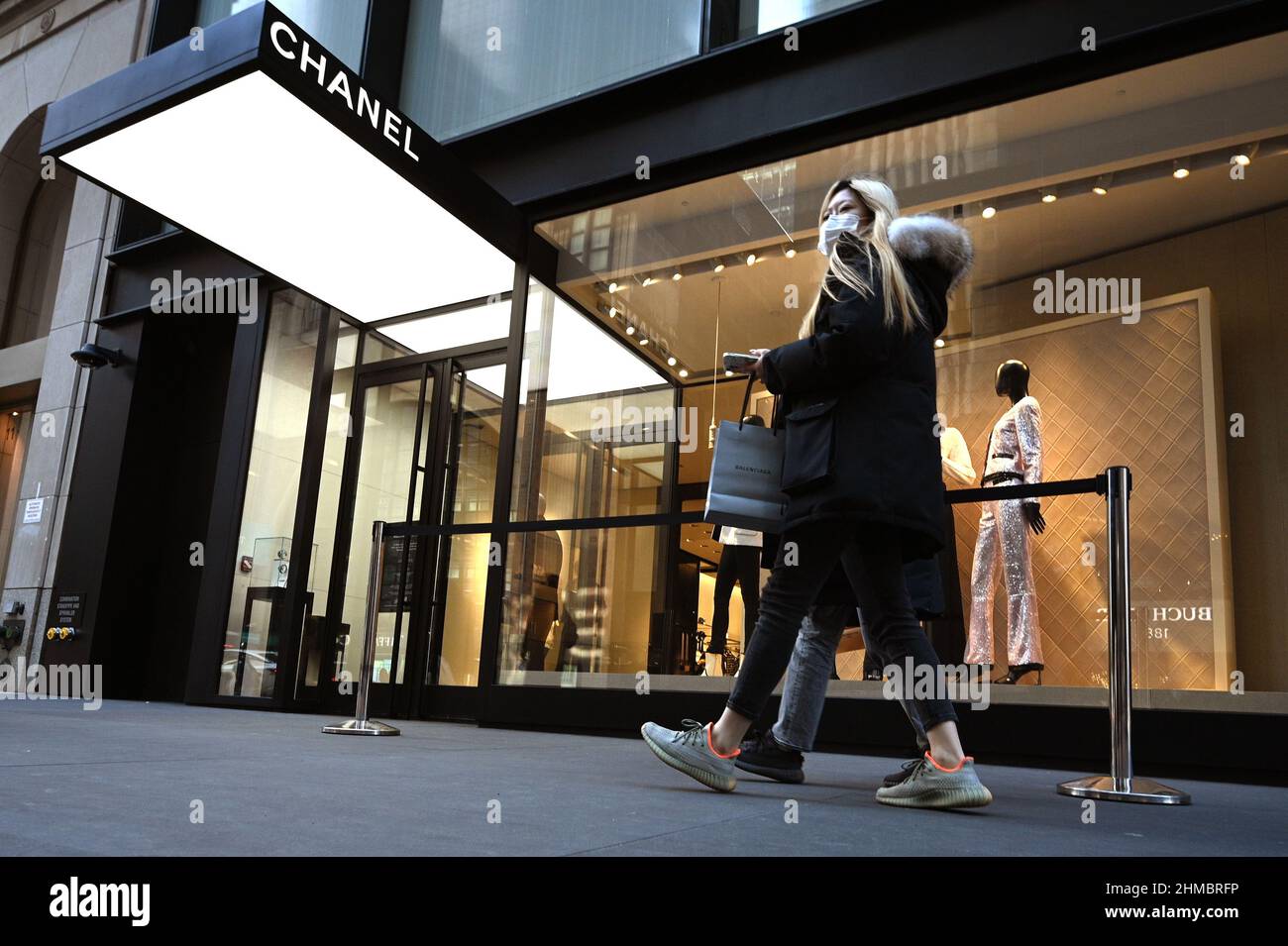 New York, USA. 08th Feb, 2022. People walk past the Chanel luxury brand  flagship store on 57 Street in New York, NY, February 8, 2022. The French  fashion house known for its