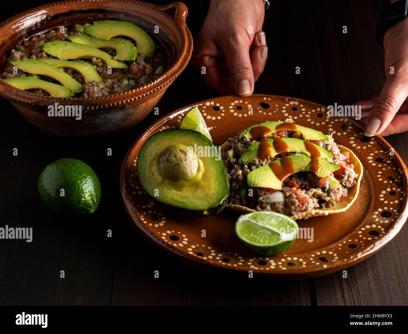 Ground beef tostadas and Mexican sauce and avocado. Stock Photo