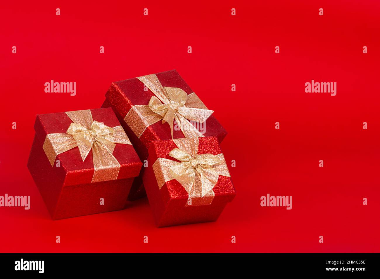 Saint Valentine's day present boxes. Red background. Stock Photo