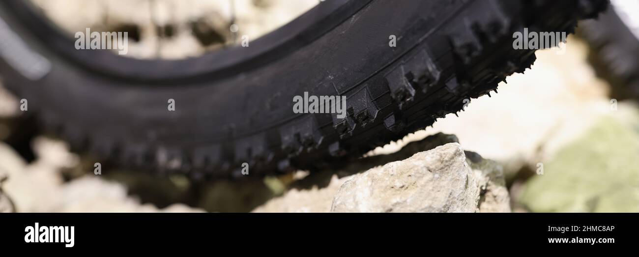 Bicycle rubber wheel standing on stones closeup Stock Photo