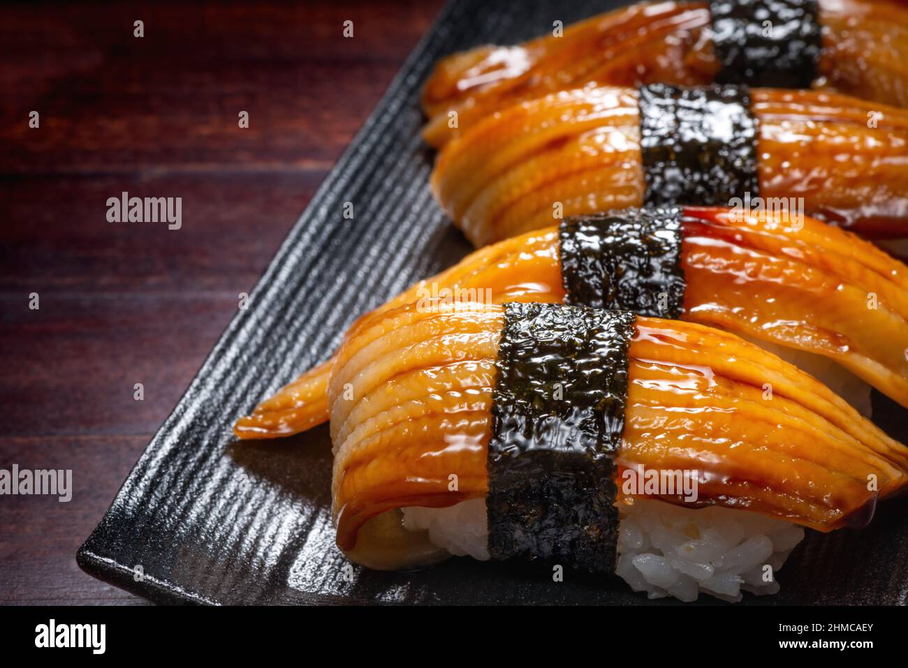 Japanese style of sushi with eel fish on black plate, Asian food, traditional Japanese food Stock Photo