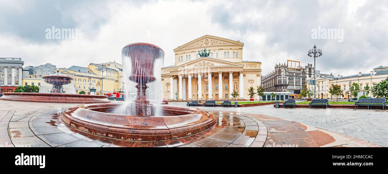 A wide panorama of the Bolshoi Theatre building and the fountain in front of it in Moscow, Russia Stock Photo