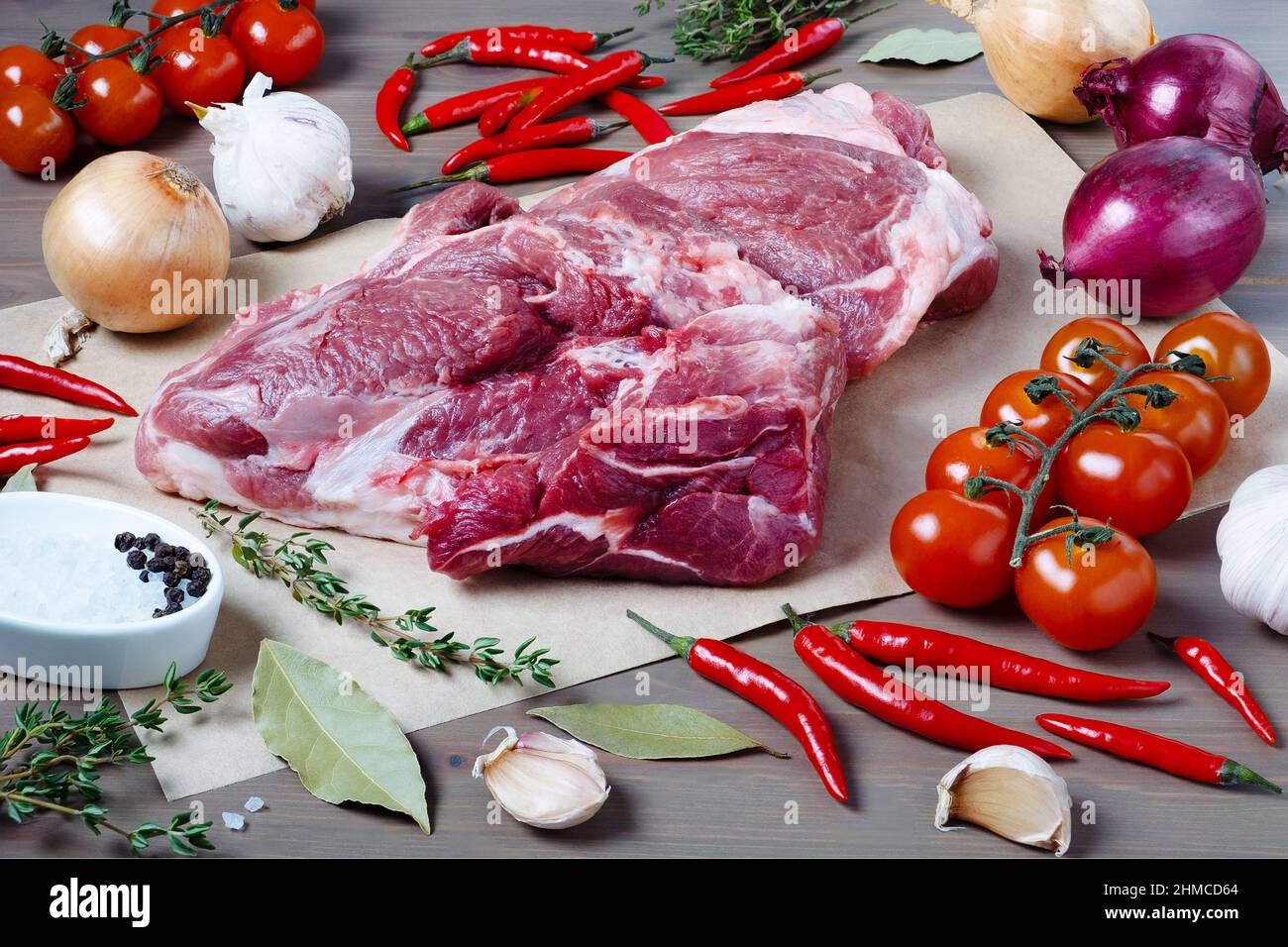 Piece of fresh pork meat on kitchen table Stock Photo