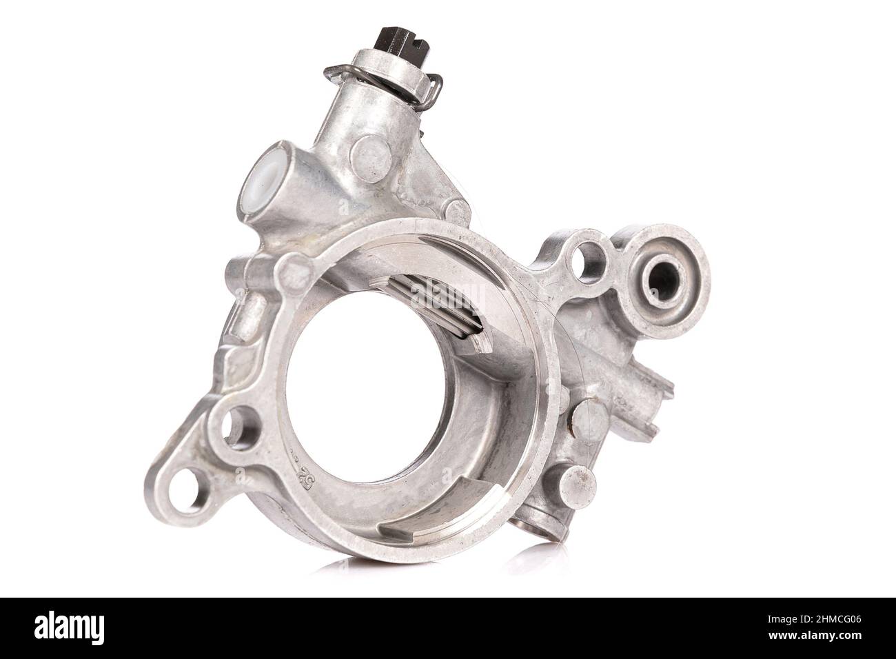 aluminum modern oil pump for a chainsaw closeup on a white background