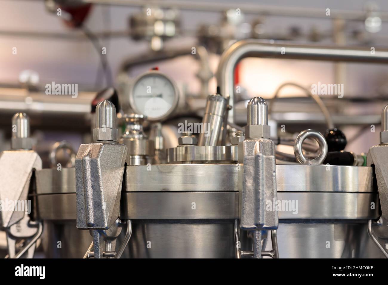Close up of stainless steel jacketed reactor. Selective focus. Stock Photo