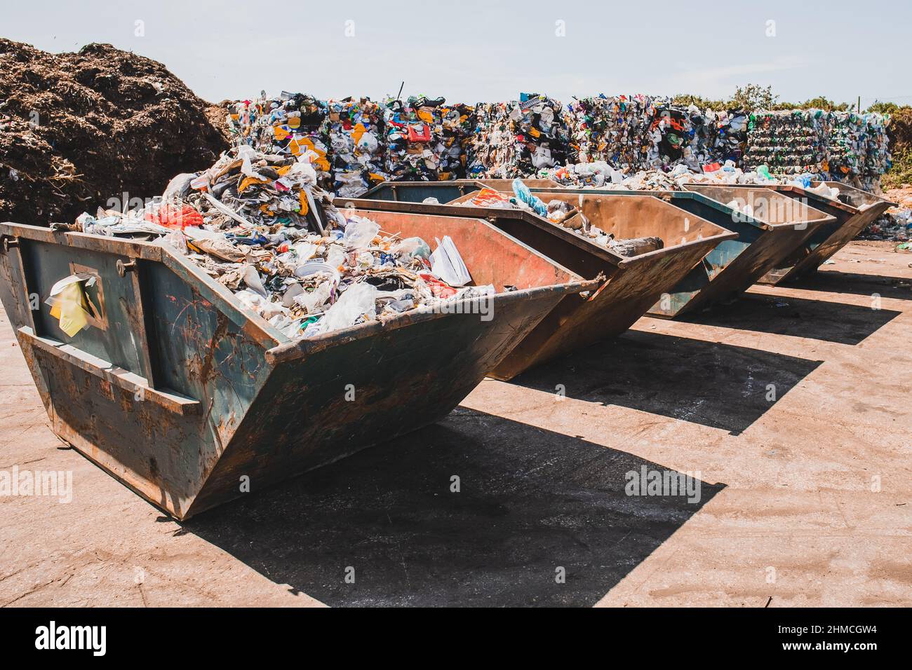 Big pile of garbage waste, stack of different types of garbage at city dump. Waste management at sorting cetre Stock Photo