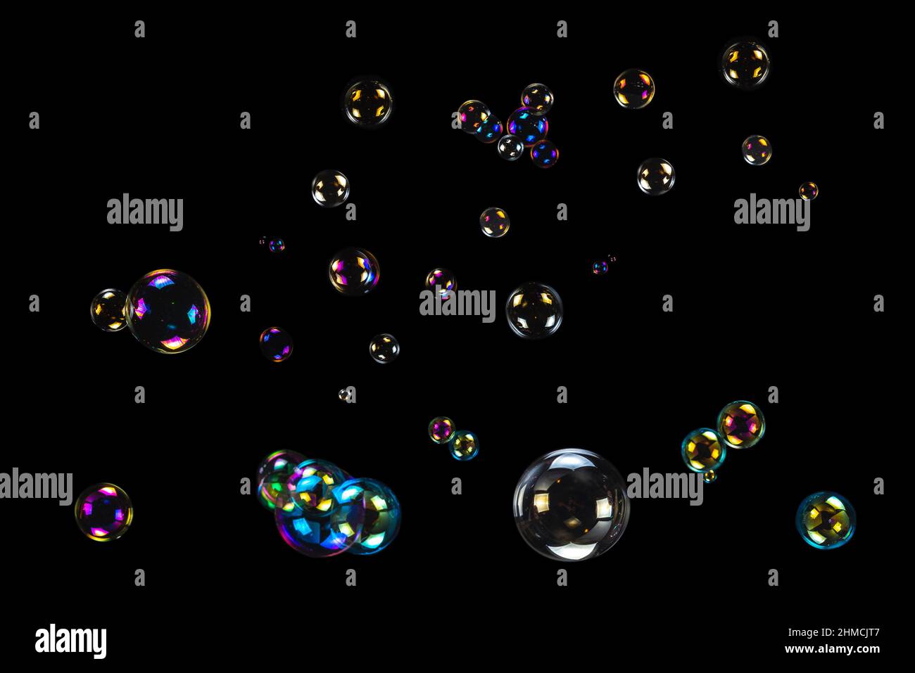 Soap bubbles isolated on a black background. Copy space Stock Photo - Alamy
