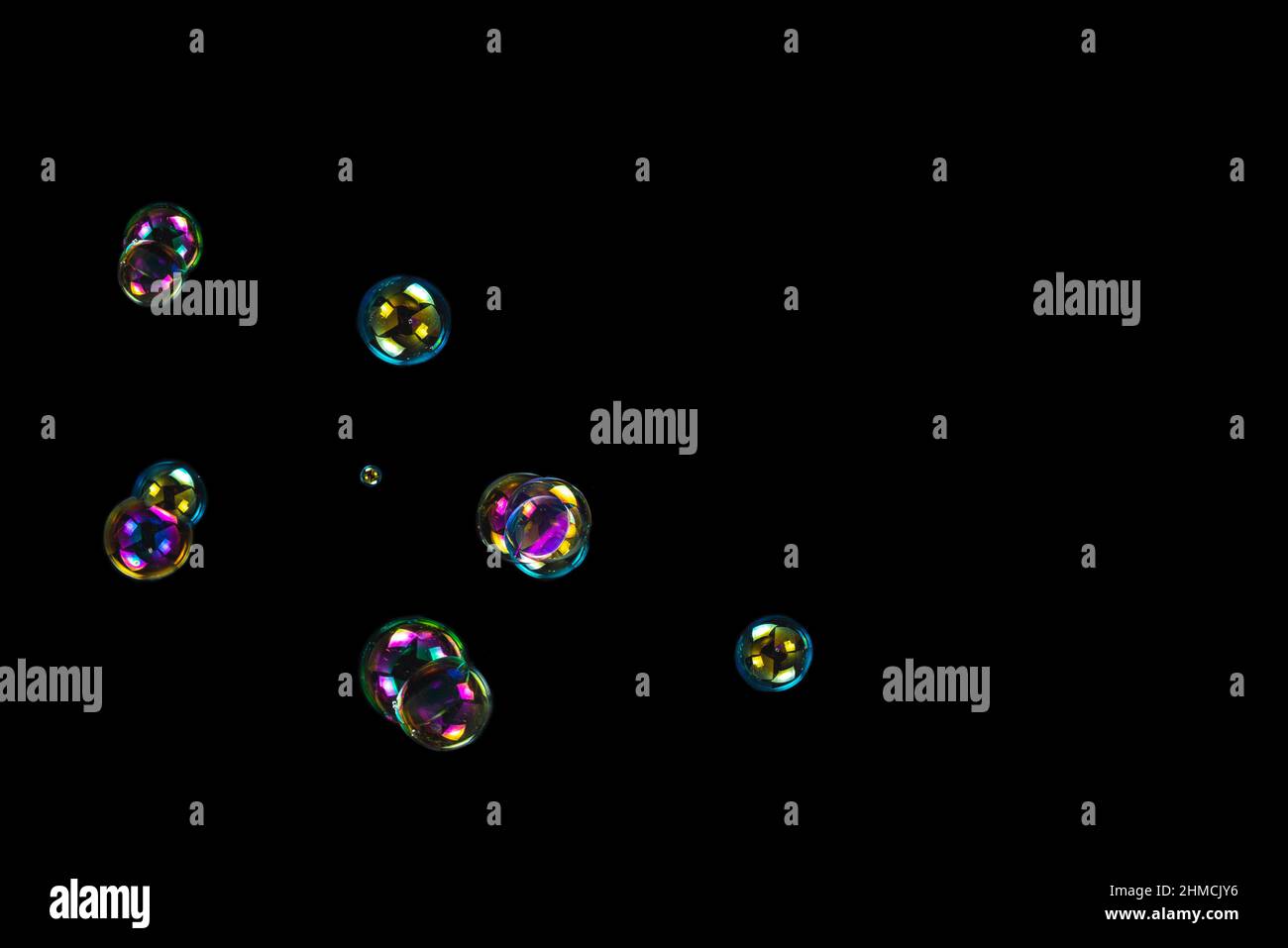 Soap bubbles isolated on a black background. Copy space Stock Photo - Alamy