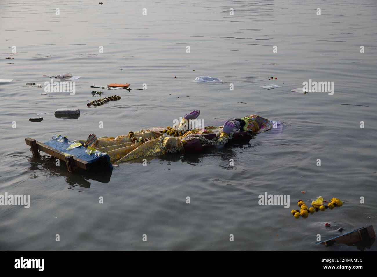 Floating Hindu goddess Saraswati idol for immersion on the Ganges after