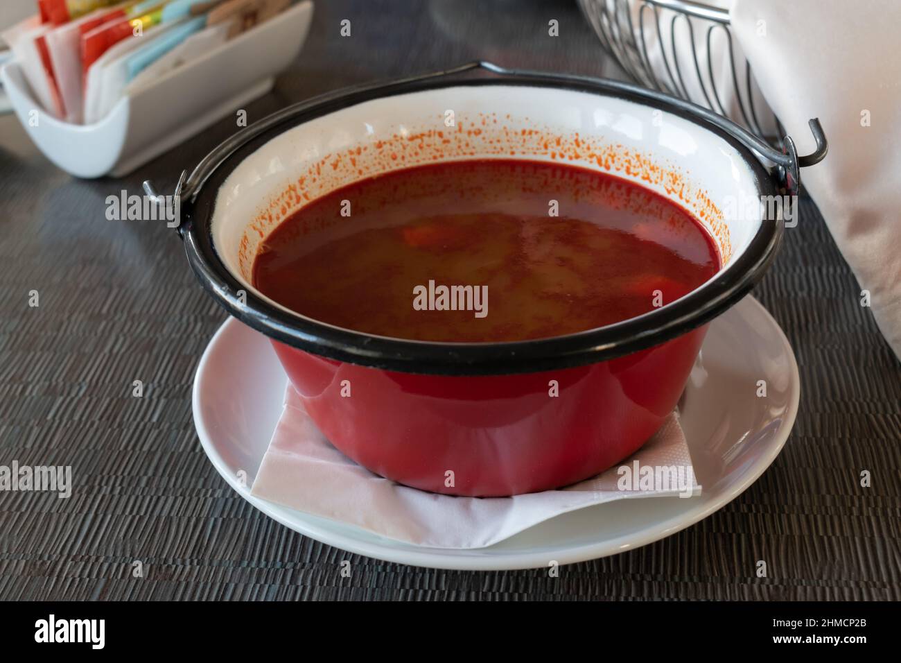 Goulash, hungarian traditional meal in metal bowl Stock Photo