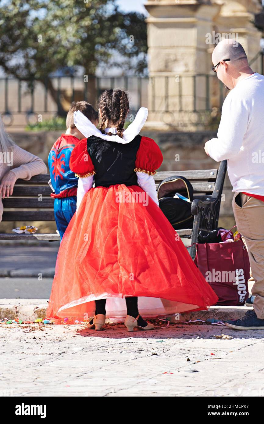 People in makeup and carnival costumes during Fat Tuesday at Mardi Gras carnival in city: Valletta, Malta - February 23, 2020 Stock Photo