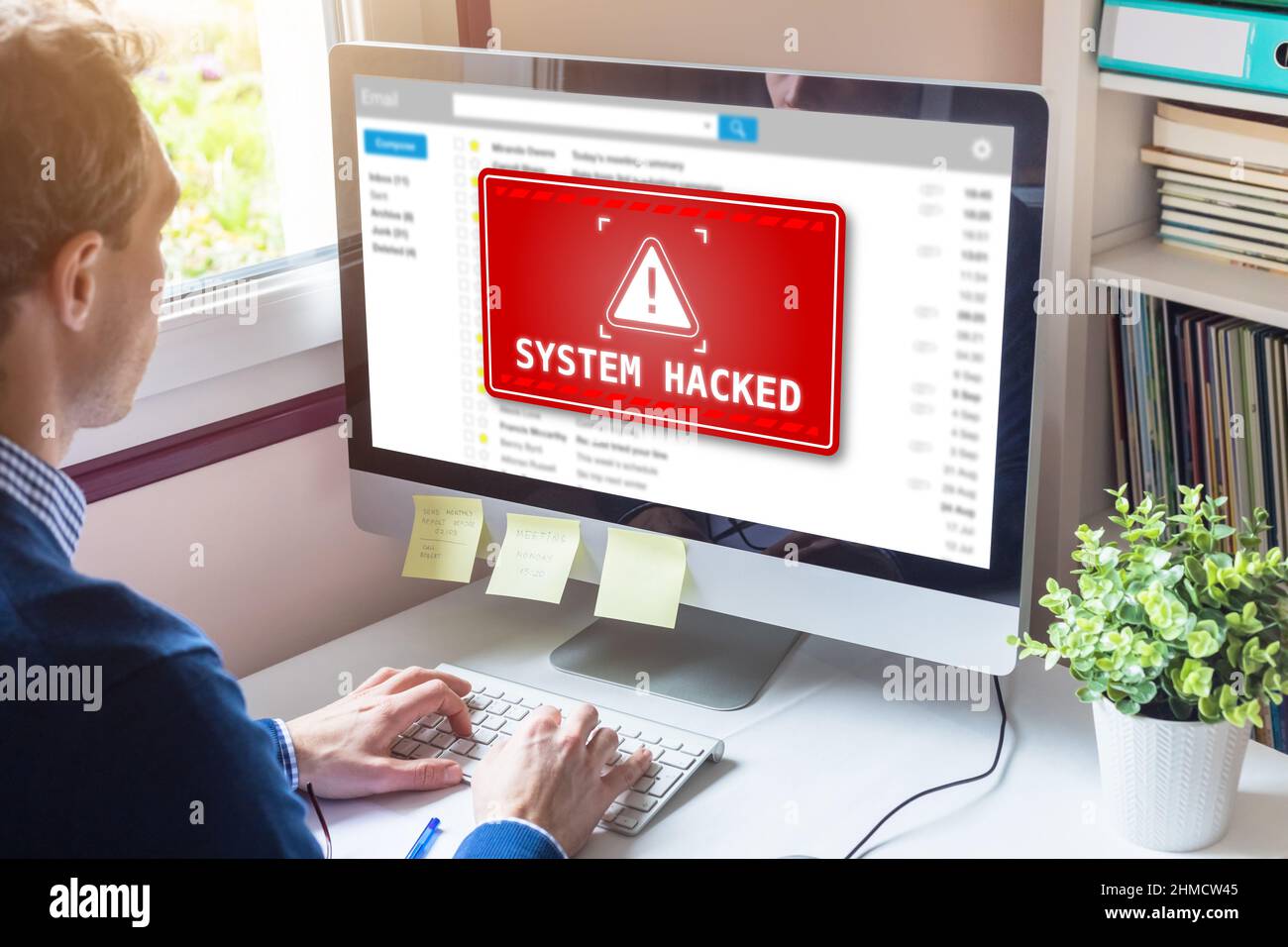 System hacked alert on computer screen after cyber attack on network. Cybersecurity vulnerability on internet, virus, data breach, malicious connectio Stock Photo