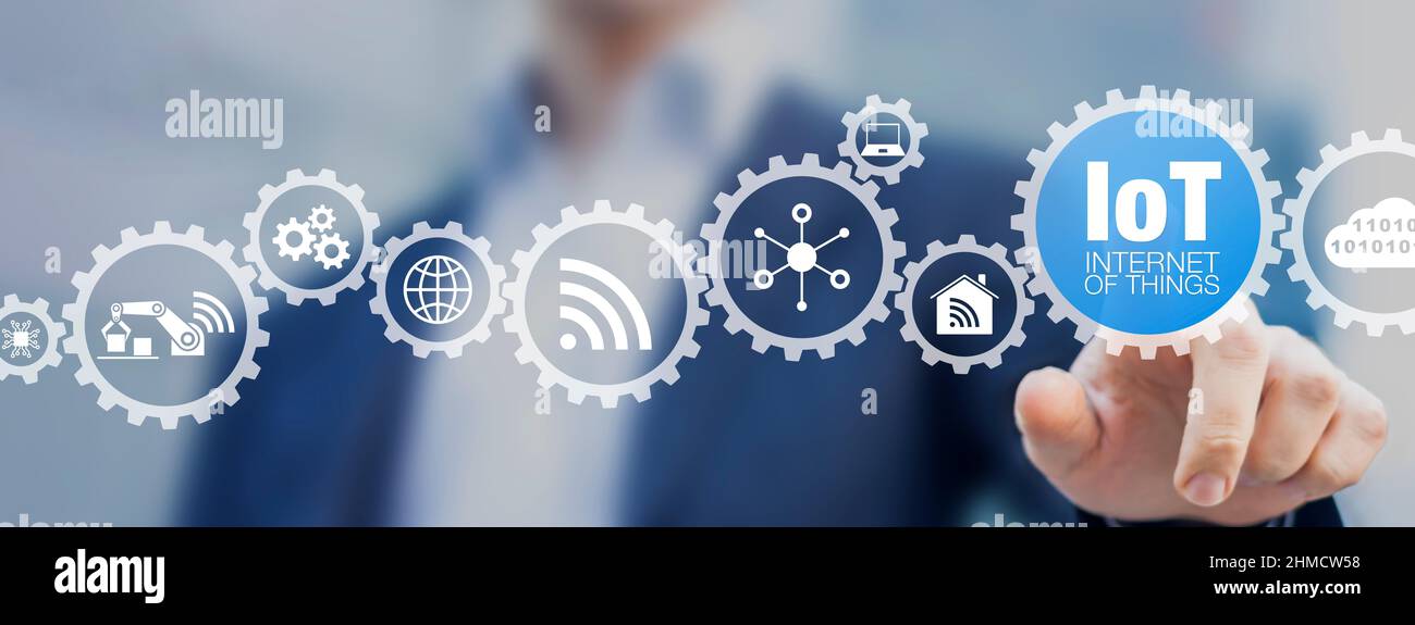 IoT Internet of Things and digital transformation concept with software or system engineer touching icons of wireless connection and data exchange for Stock Photo