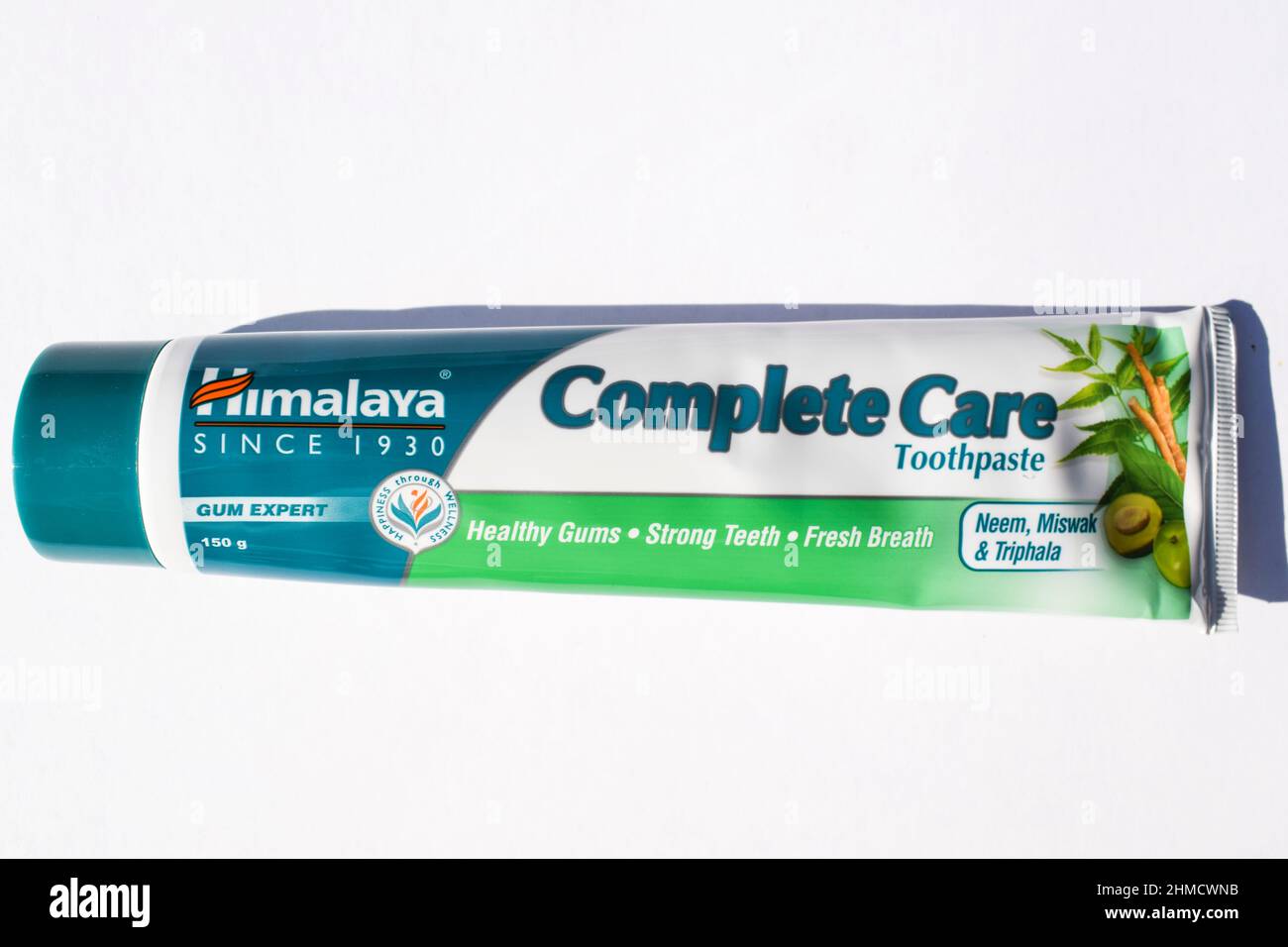 Himalaya brand Complete care herbal tooth paste. With Neem, miswak triphala herbs. Indian brand toothpaste tube on white background Stock Photo