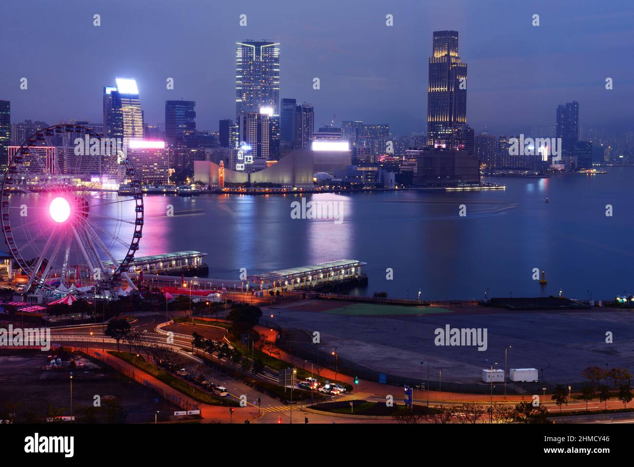 A view of the picturesque Victoria harbour and the Kowloon waterfront. Picture taken from Wan Chai, Hong Kong. Stock Photo