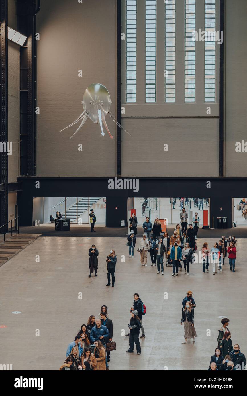 London, UK - October 23,2021: People under aerobes of Anicka Yi's installation In Love With The World in Turbine Hall of Tate Modern,a museum in Londo Stock Photo