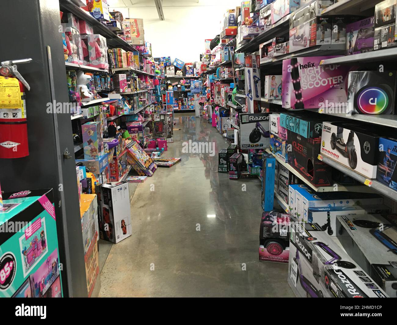Augusta, Ga USA - 12 20 20: Walmart interior junky messy toy aisle items on floor trip hazard Stock Photo