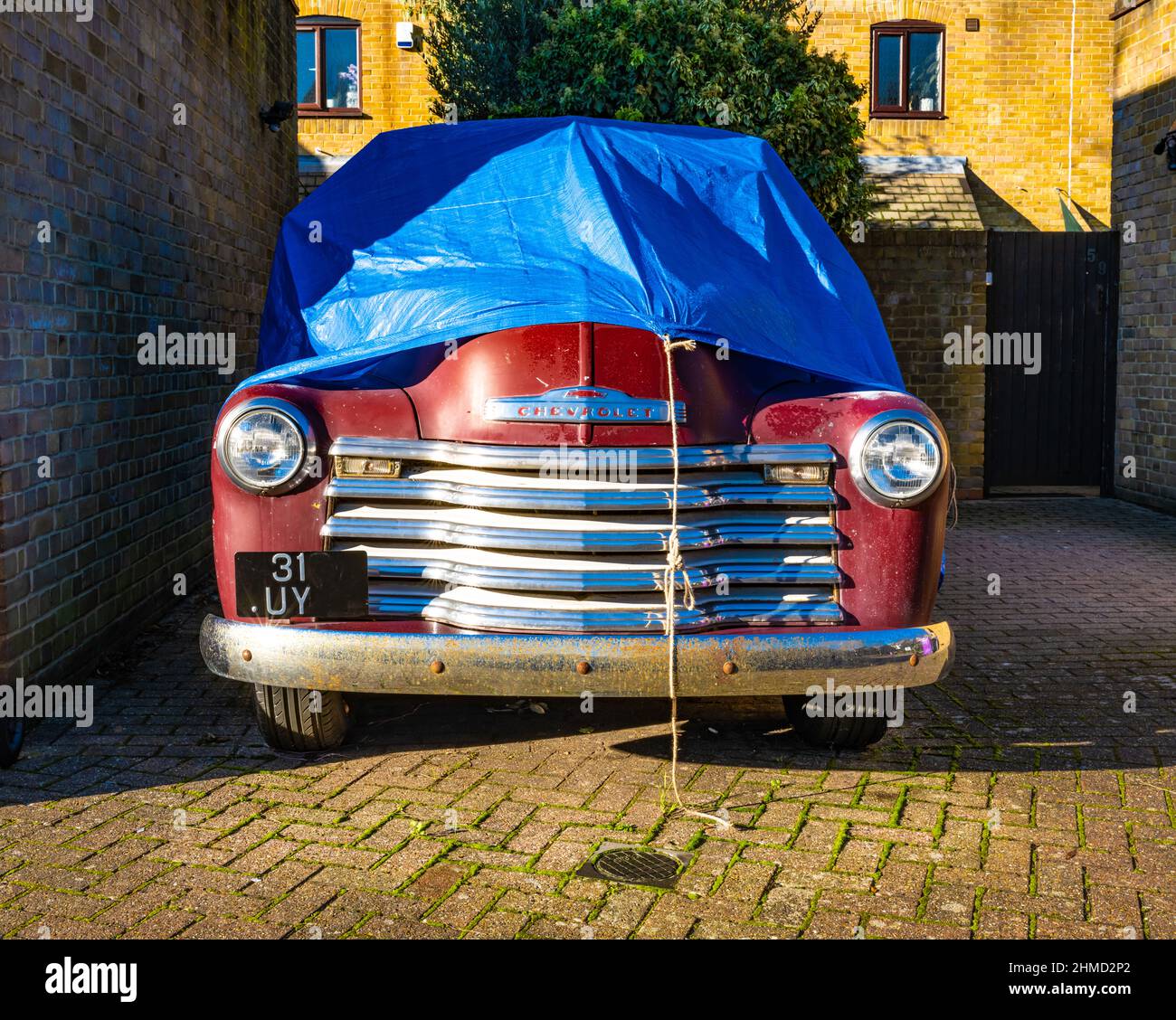 Old Chevrolet under cover Stock Photo