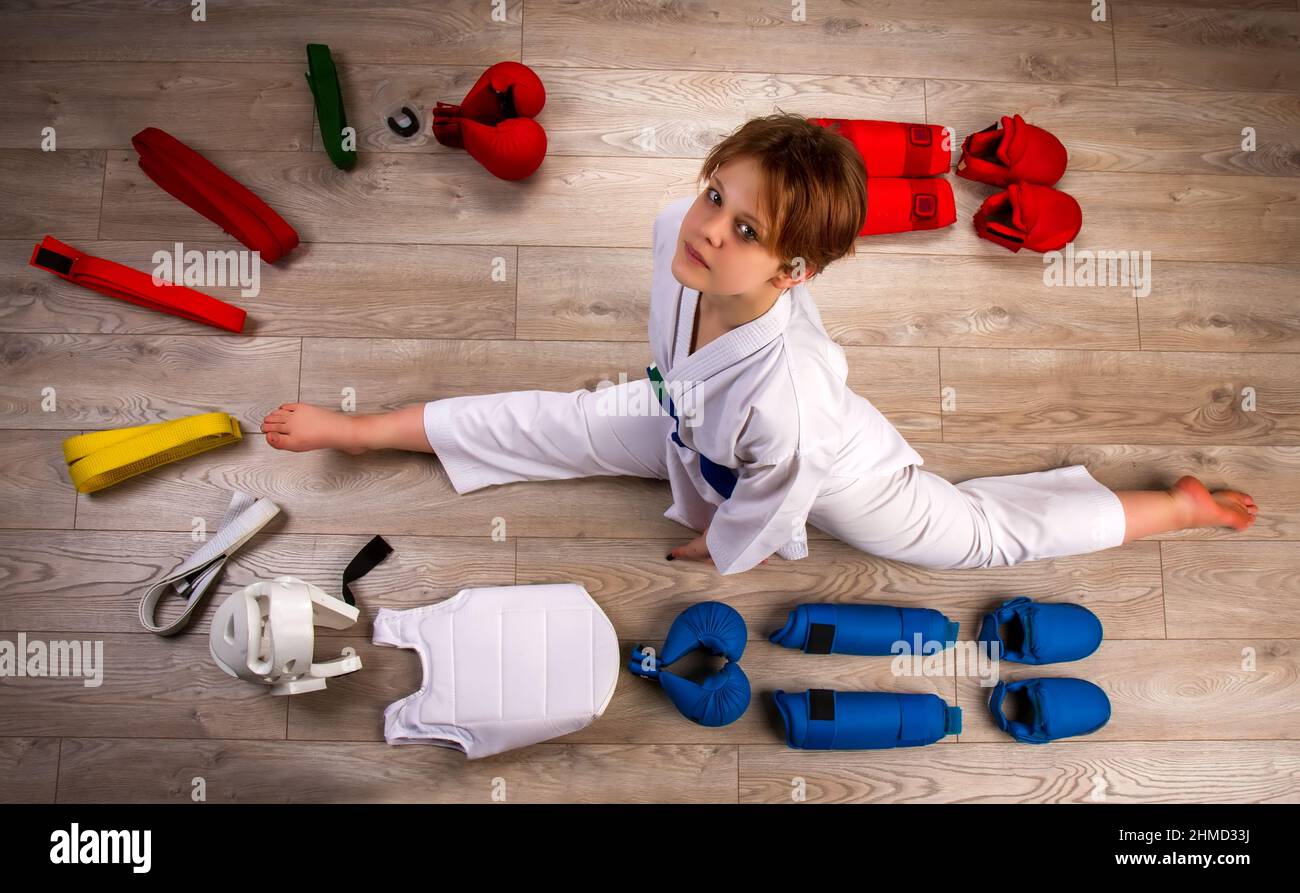 Conceptual image in flat lay style of a little karateka girl surrounded by her equipment necessary for training and competition Stock Photo