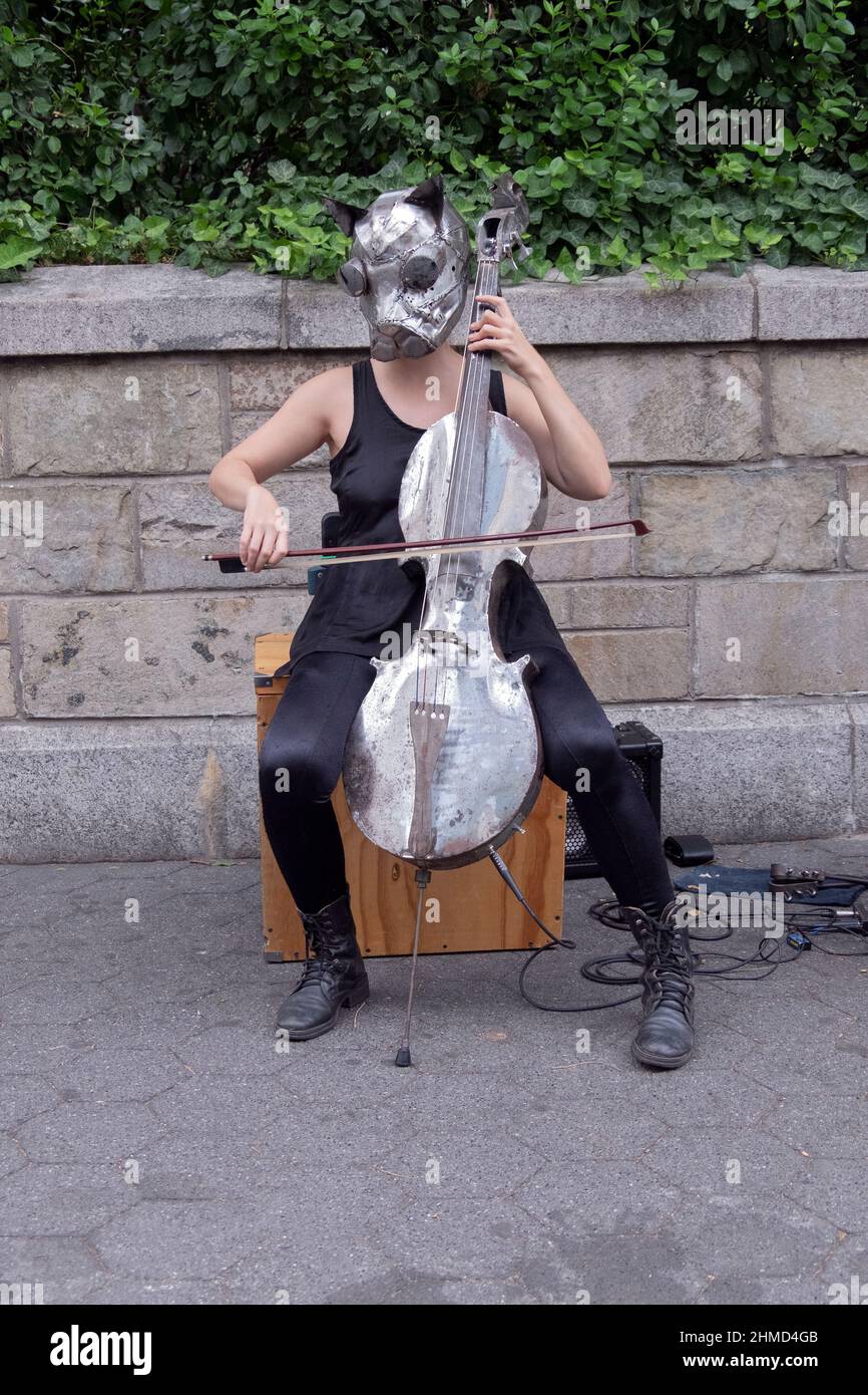 A member of Ensamble Ferroelectrico de Marte from Argentina plays an unusual instrument in Union Square Park in Manhattan, New York. Stock Photo