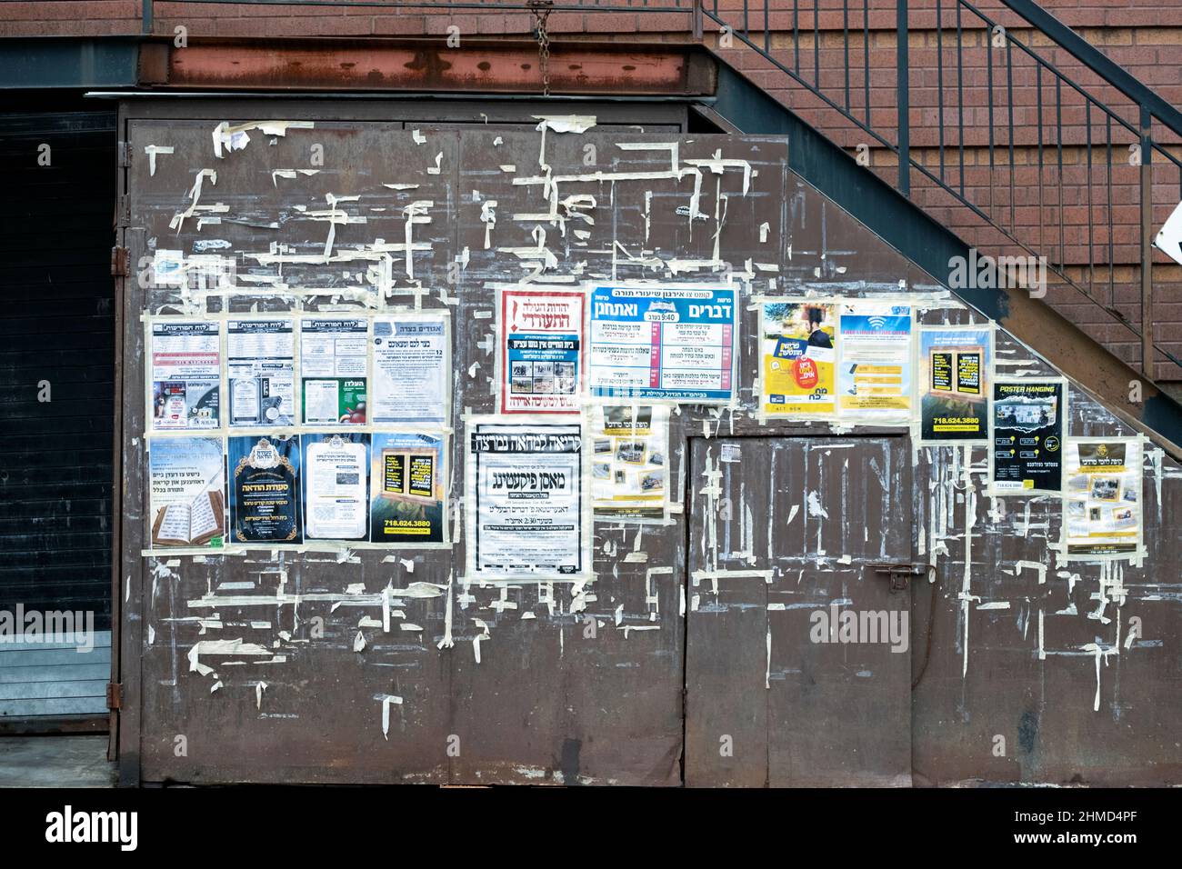 A wall with advertisements and notices in Williamsburg, Brooklyn, a