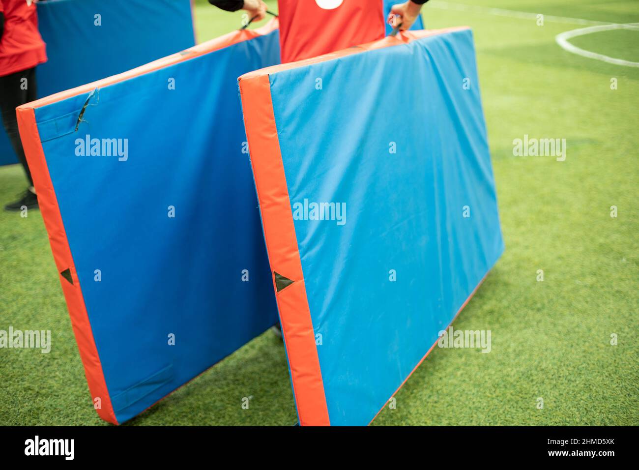 Carpet for wrestling. Sports equipment on street. Carrying gymnastic