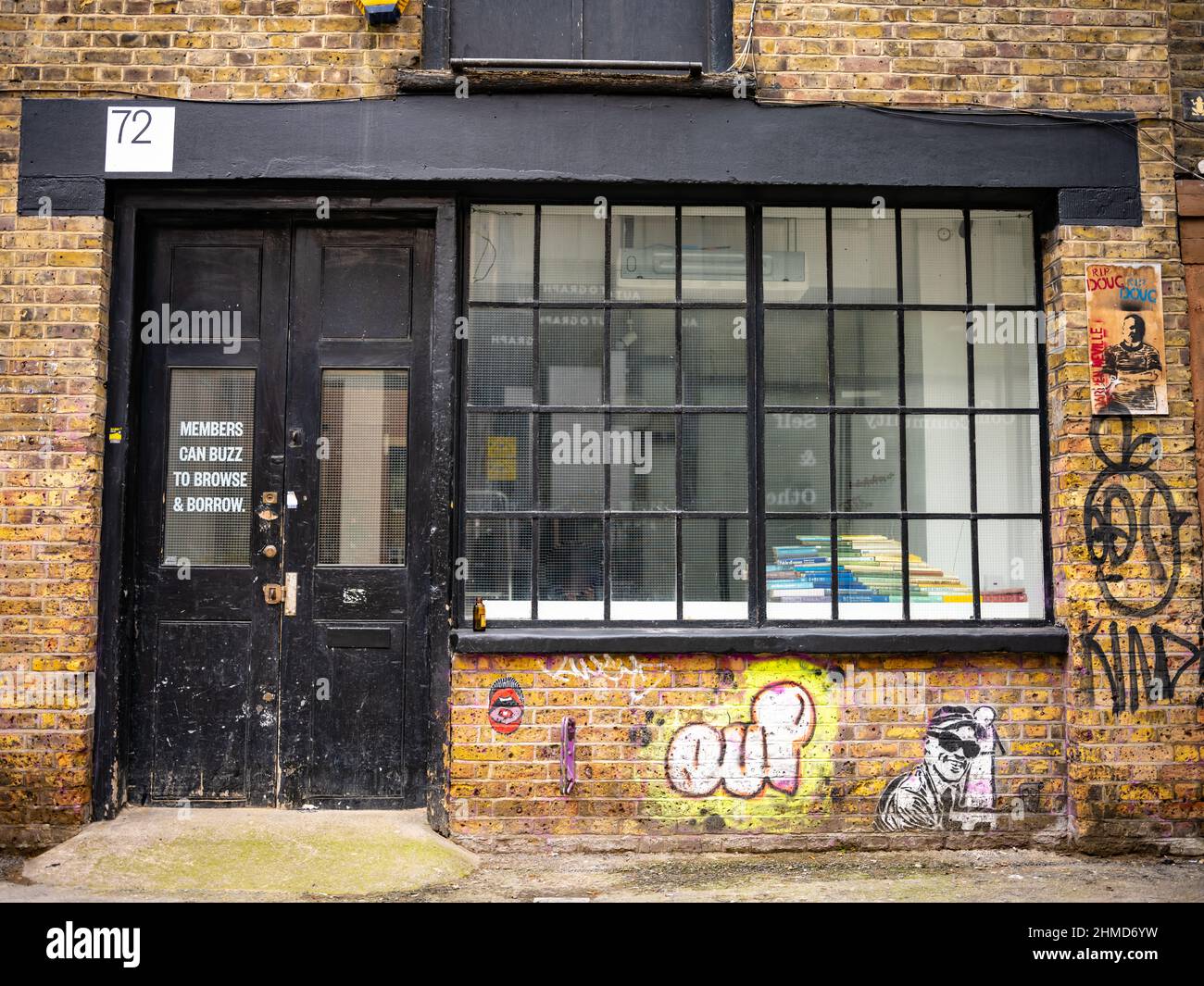 Office on Rivington Street, Shoreditch, London. Banksy style artwork. Stock Photo