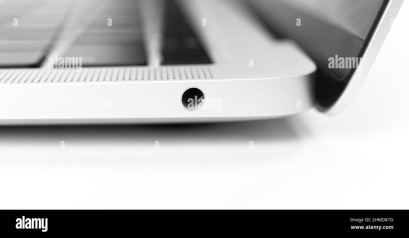 Laptop headphone jack close-up. Modern 3.5mm jack connection. Technology background photo Stock Photo