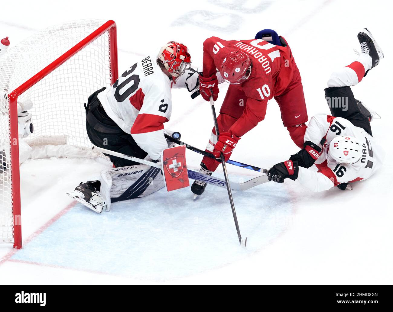 Beijing, China. . 09th Feb, 2022. Beijing, China. 9th Feb, 2022. Dmitri Voronkov (C) of ROC competes during the ice hockey Men's Preliminary round group B match between ROC and Switzerland at National Indoor Stadium in Beijing, capital of China, Feb. 9, 2022. Credit: Chen Jianli/Xinhua/Alamy Live News Credit: Xinhua/Alamy Live News Stock Photo