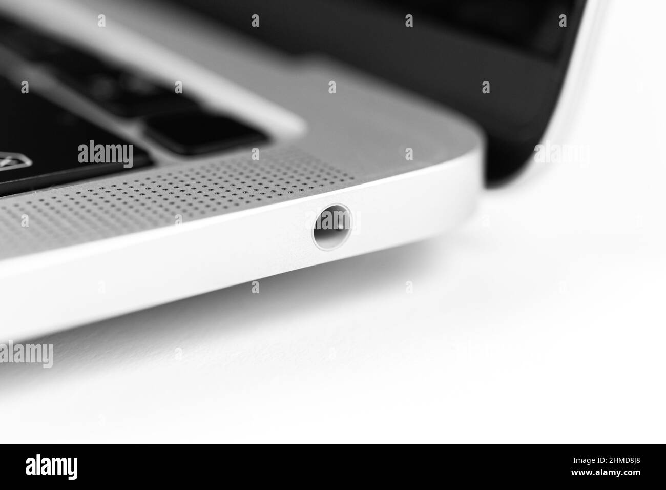 Laptop headphone jack close-up. Modern 3.5mm jack connection. Technology background Stock Photo