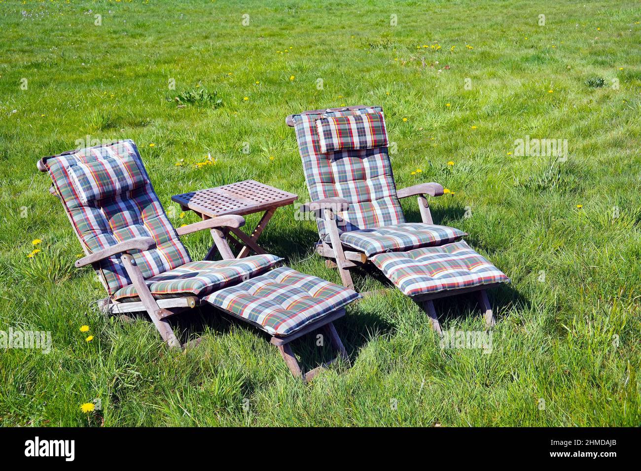 Two seats on a grass court Stock Photo