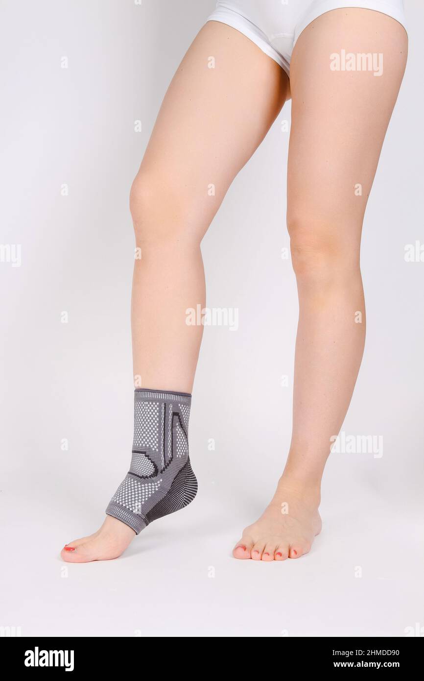 Orthopedic Ankle Brace. Medical Ankle Bandage. Medical Ankle Support Strap Adjustable Wrap Bandage Brace foot Pain Relief Sport. Leg Brace isolated on Stock Photo