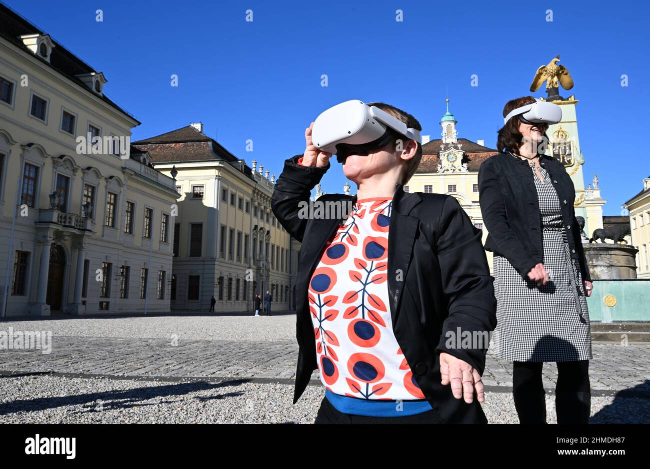09 February 2022, Baden-Wuerttemberg, Ludwigsburg: Simone Fischer (l), the Representative for the Disabled of the State of Baden-Württemberg, and State Secretary Gisela Splett (r) stand in the courtyard of the palace complex during the presentation of a pilot project for virtual tours of three areas of the Ludwigsburg Residence Palace using data glasses. Thanks to virtual reality, rooms can be visited that are otherwise inaccessible. Photo: Bernd Weißbrod/dpa Stock Photo