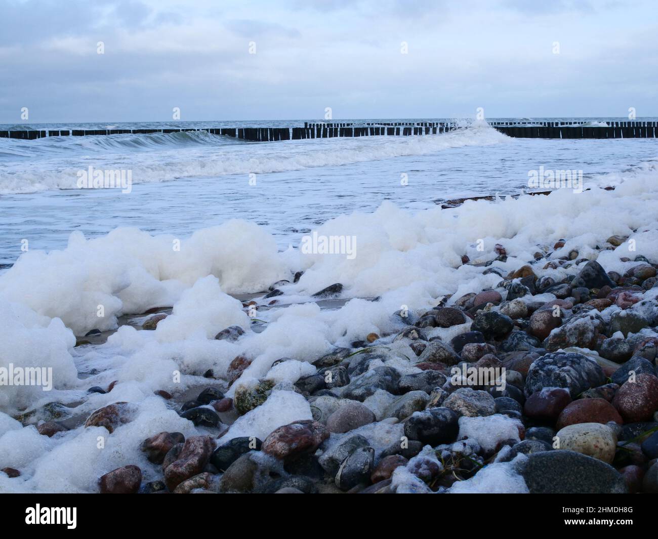 06 February 2022, Mecklenburg-Western Pomerania, Prerow: 06.02.2022, Wustrow on the Darß. Foam piles up on a stormy day on the beach of the Baltic Sea in Wustrow. The foam is considered non-toxic and harmless to humans - it consists of algae remains and small air bubbles. Photo: Wolfram Steinberg/dpa Photo: Wolfram Steinberg/dpa Stock Photo