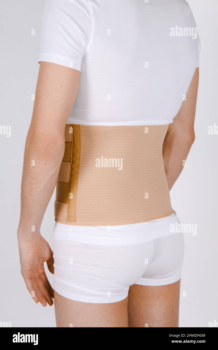 Orthopedic lumbar corset on the human body. Back brace, waist support belt  for back. Posture Corrector For Back Clavicle Spine. Post-operative Hernia  Stock Photo - Alamy